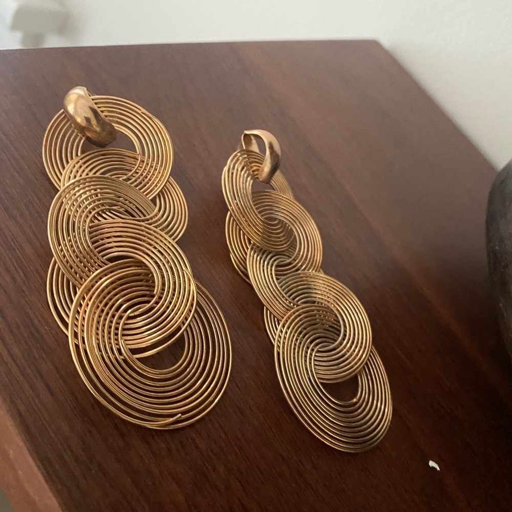 Gold tone large spiral statement earrings
